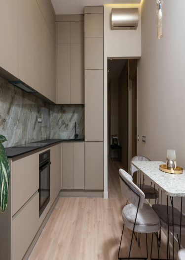 image of Beige Aluminum Kitchen With Natural Marble Countertops